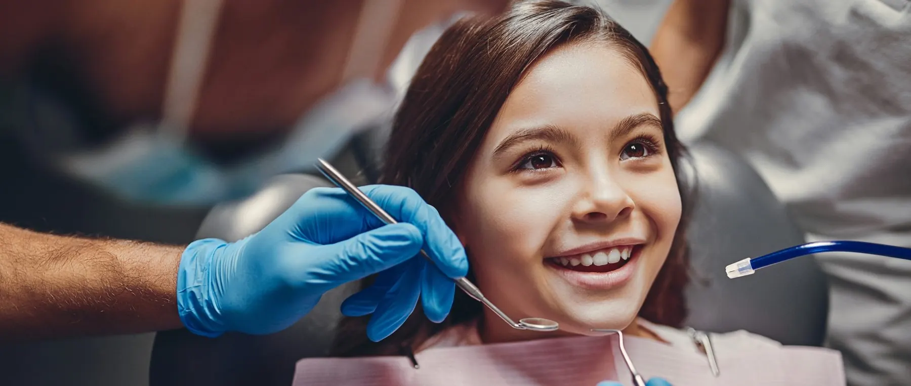 Child smiling during a dental visit